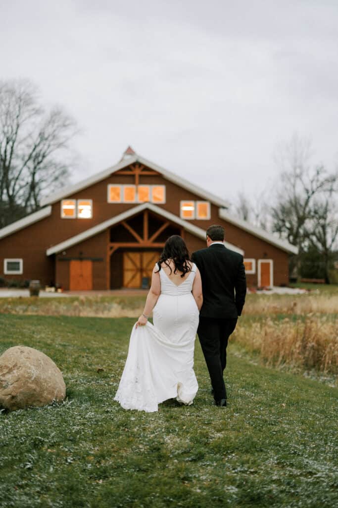 Couple walks side by side with Barnwood events behind them in Madison, Wisconsin