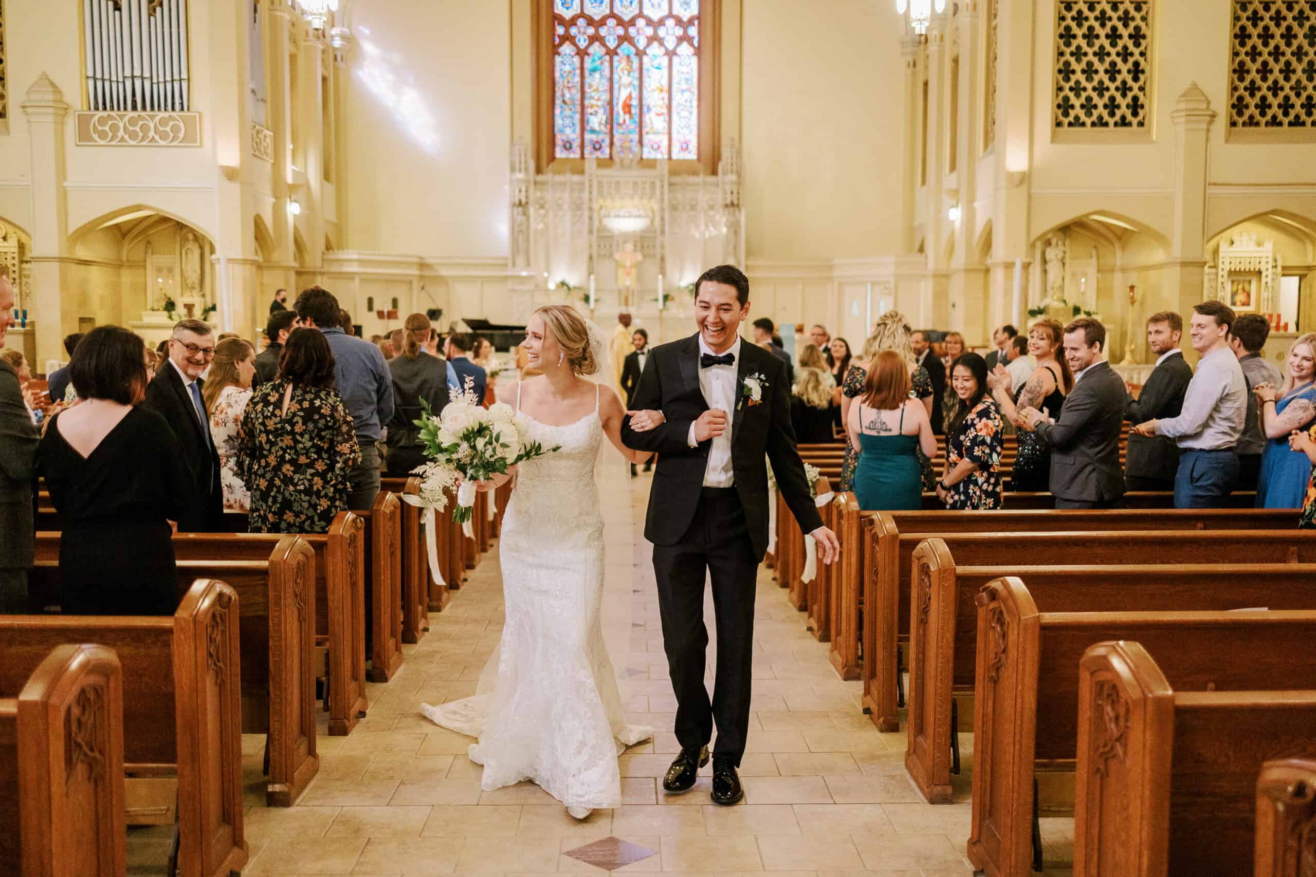 bride and groom walk down aisle after being pronounced husband and wife