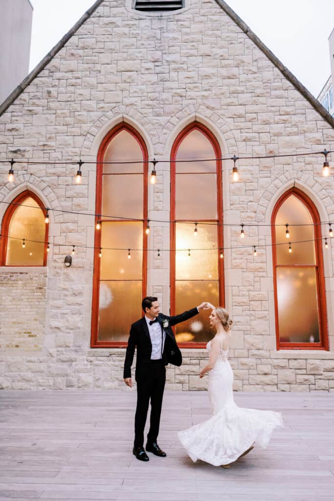 Couple dances at their wedding venue St James 1868 in milwaukee wisconsin