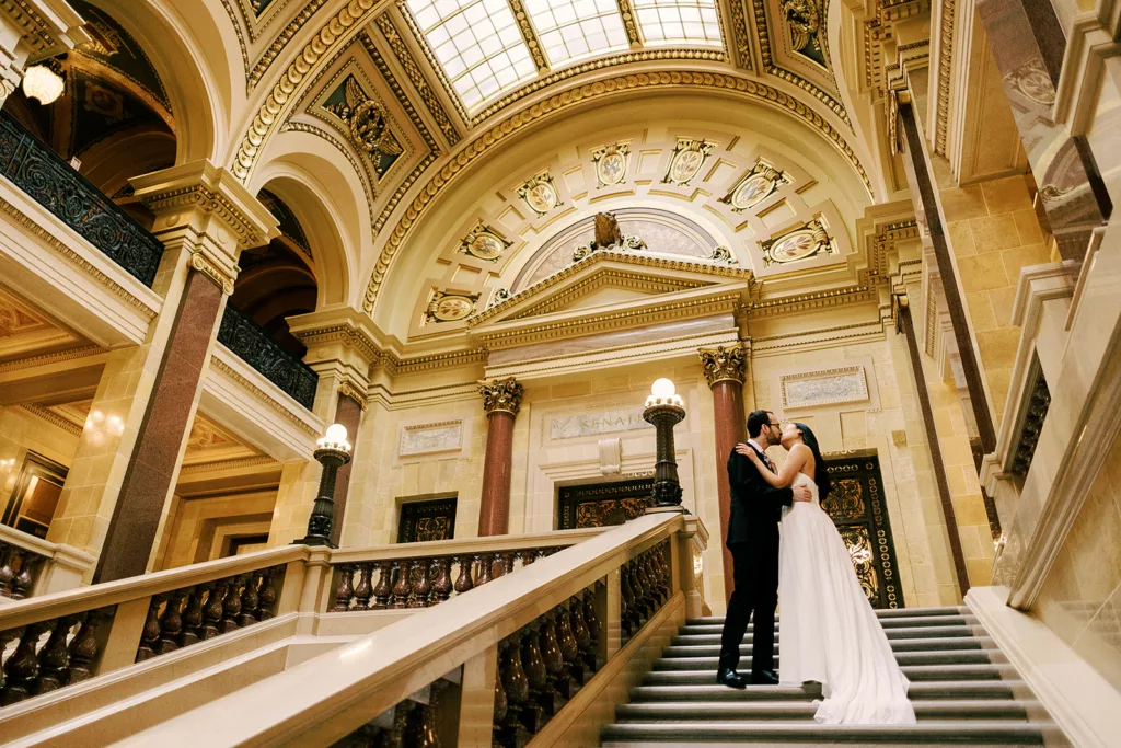 bride and groom kiss in the madison capitol building the day of their elopement
