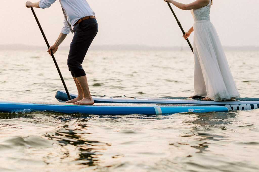 couple paddleboards at Devil's Lake
